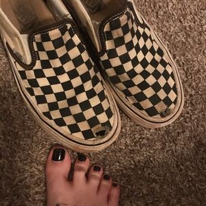 Well worn vans slip on checkerboard shoes